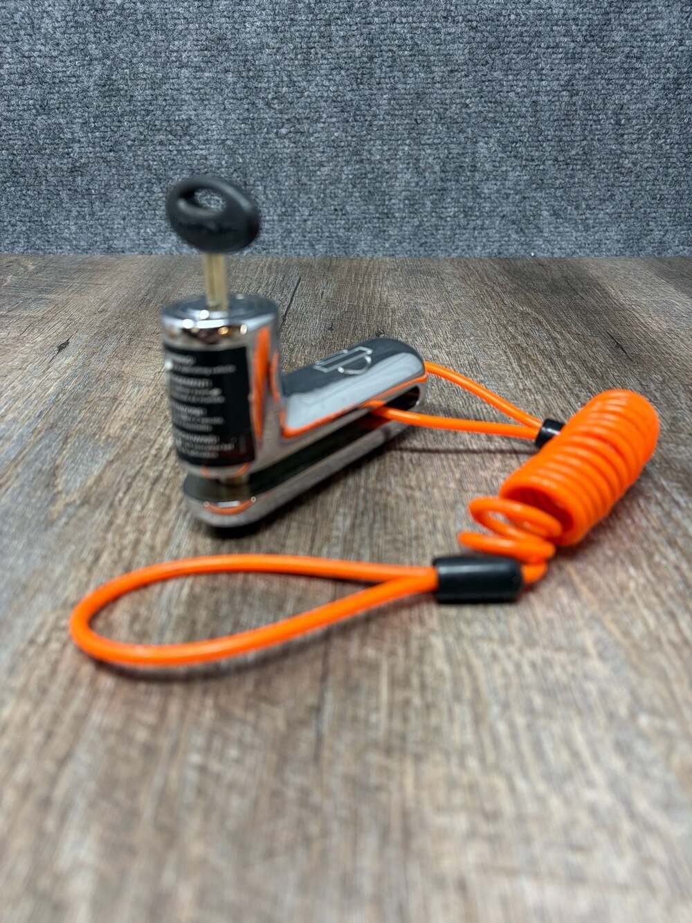 Genuine Harley-Davidson Chrome Disc Brake Rotor Lock with orange reminder cord